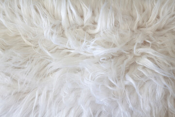 Fluffy soft white material. Cushion fabric. Artificial fur.