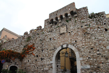 medieval gate (porta catania) in taormina in sicily (italy) 