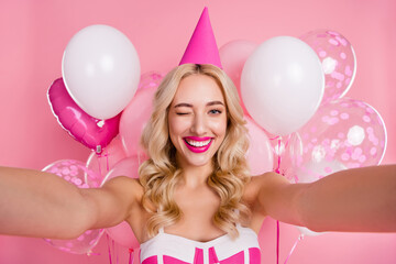 Self-portrait of attractive cheerful cute trendy flirty wavy-haired girl celebrating winking...