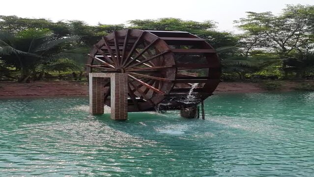 water mill spins with the power of water.