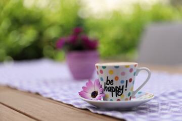 Closeup photography of Turkish coffee with be happy text on it