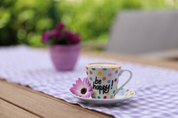 Closeup photography of Turkish coffee with be happy text on it