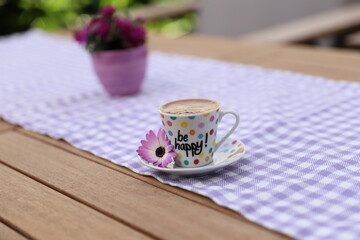 Closeup photography of Turkish coffee with be happy text on it