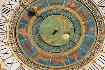 Fototapeta na wymiar Brescia downtown. Clock and bell tower in Renaissance style, 1540-1550, in Loggia town square (Piazza della Loggia). Lombardy, Italy, Europe. Astronomical clock with the constellations of the zodiac.