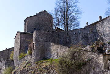 Fototapeta na wymiar Medieval stone building with art house at the old town of Sion on a sunny spring day. Photo taken April 4th, 2022, Sion, Switzerland.