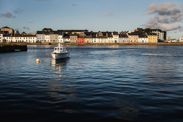 Old wooden shipwrecks in Claddagh Bay, Galway, sunny day in beautiful and popular tourist spot with...