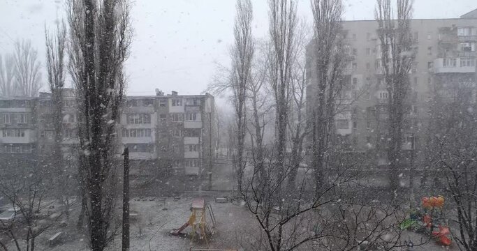 landscape with soviet houses during snowfall