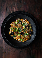 Lentil salad with quinoa, cherry tomato, broccoli, avocado, olives and vinaigrette sauce