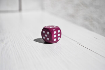 Crimson dice with white dots