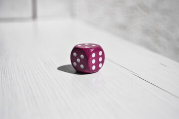 Crimson dice with white dots