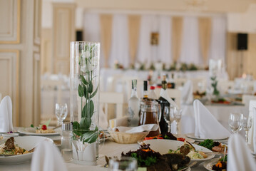 Stylish decorated wedding tables with flowers