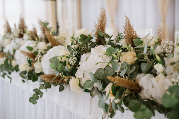 Stylish decorated wedding tables with flowers