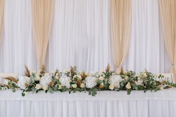 Stylish decorated wedding tables with flowers