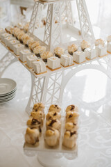 Various desserts and cake on the buffet table at the wedding