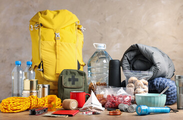 Disaster supply kit for earthquake on wooden table