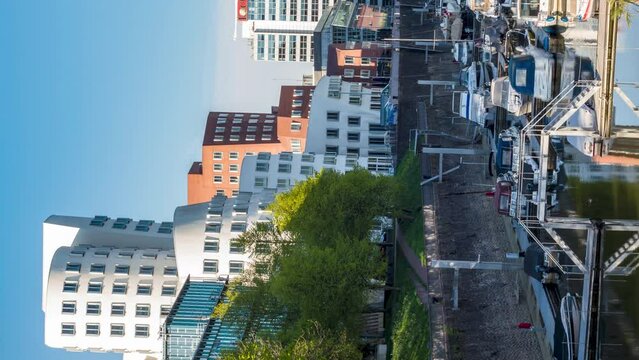Futuristic buildings in Media Harbour, Duesseldorf on a sunny day. Vertical video time lapse