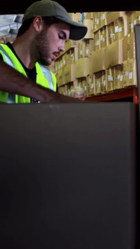 Delivery driver loading his van with boxes
