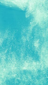 Man diving into blue swimming pool