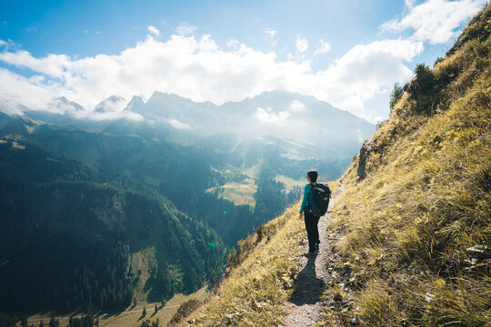 A female Hiker enjoying the view of Allgaeuer Alps, Germany