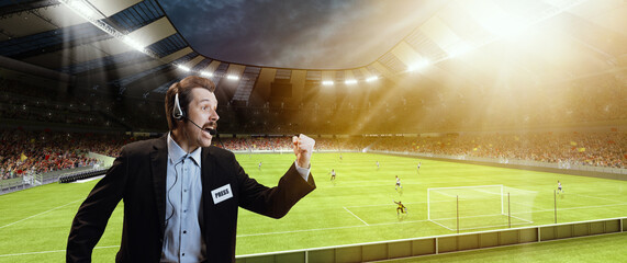 Emotional man, professional sport commentator, pressman during football match isolated over sport stadium background. Sport, league, game - obrazy, fototapety, plakaty