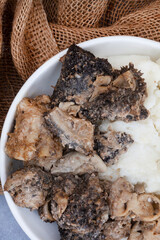 Mogodu, a Traditional South African stew made of chopped innards of a cow or tripe served with pap or maize meal.