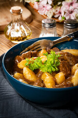 Beef stew in gravy.