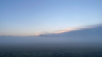 Fototapeta na wymiar Foggy morning in a Dutch polder near Den Bosch