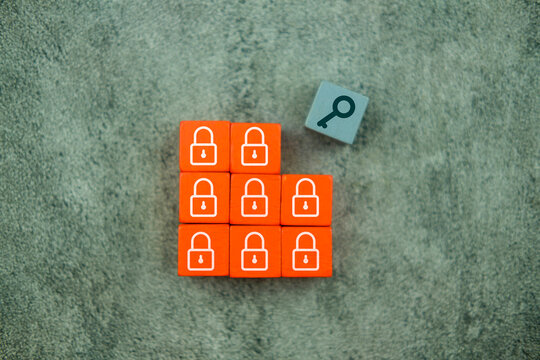 Orange blocks wood with padlock symbols and key symbols on grey wood block to complete.