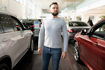 Fototapeta na wymiar buyer in a car dealership chooses a new car