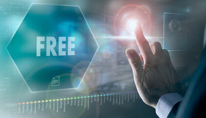 A businessman controlling a futuristic display with a Free business concept on it.