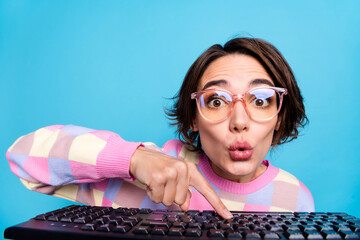 Photo of impressed millennial brunette lady type laptop wear spectacles pink sweater isolated on...