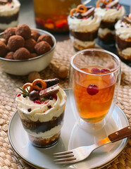 Homemade trifle with cream cheese, chocolate, jelly and berries.