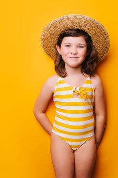 Cheerful girl in straw hat