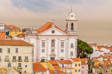 A view down from the top of the Alfama distict towards the Targus River in the city of Lisbon on a spring day