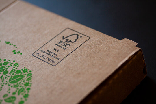 FSC logo printed on sustainable Compostable cardboard pizza box. FSC - The Forest Stewardship Council. Shallow depth of field and selective focus image. Copenhagen, Denmark - april 22, 2022.