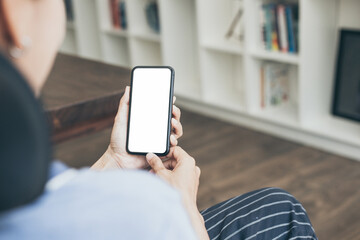 cell phone blank white screen mockup.hand holding texting using mobile on desk at office.background empty space for advertise.work people contact marketing business,technology