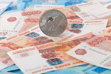 One US Dollar on Russian ruble. Money background. Currency exhange. Economic crisis. Rouble dollar cash. Hundred dollar bill and 5000 rubles. Business and finance. Russia and USA