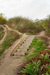 Kyiv (Kiev), Ukraine - October 23, 2020: Strange contrate stairs, steps outdoors on a hill in autumn with many multicolored leaves around