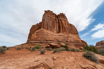 Fototapeta premium Arches National Park at Midday - Arches has many arches including the famous Delicate Arch, the Window Arch, the Double Arch and other features such as Tower of Babel, Turret Arch, and the Courthouse 