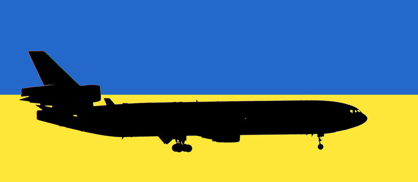Schwarze Silhouette eines Flugzeugs vor den Farben der Ukraine