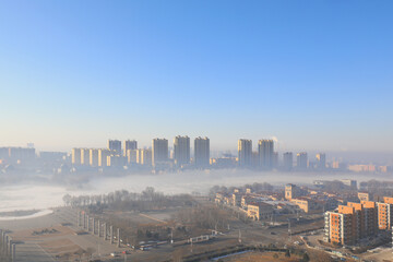Buildings in advection fog, beautiful urban scenery, North China