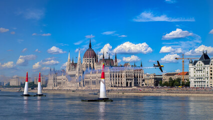 contrail of sport aircraft race at the airshow in front of the parlament in Budapest above Danube