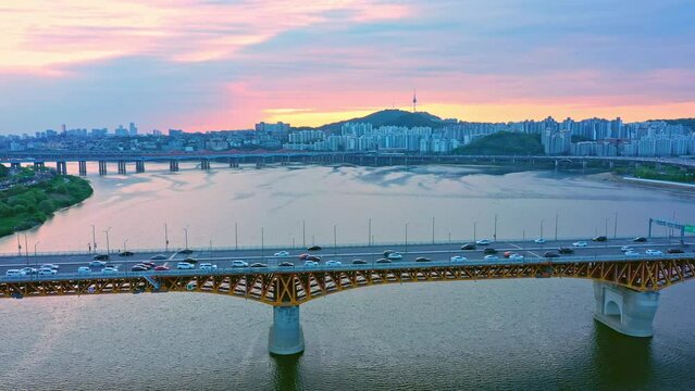 Aerial view, Drone view,Drone footage, han river bridge traffic  in Seoul south korea city and sunset sky