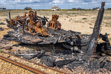 Remains of an old burnt wooden boat, Dungeness, Kent, England