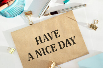 Have a nice day message written on crafted envelope on the office desk.