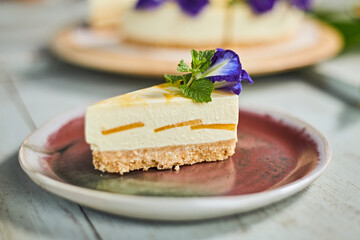 mango cheese cake on wood background