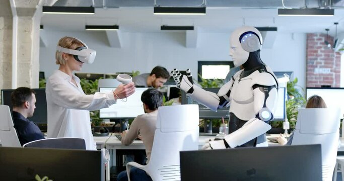 Woman in headset programming robot with metaverse tools. Developer in VR checking work of cyborg by virtual reality. Humanoid moving, executing instructions. Communication, digital transformation