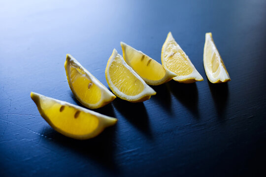  Sliced Lemon On Dark Blue Table Background