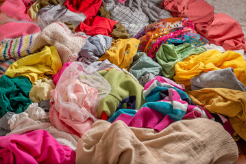 Pile of used clothes. Second hand for recycling. The concept of sustainable living, fashion and shopping habits - 500440948