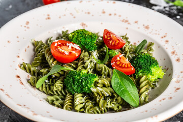 Vegetable penne pasta with spinach. proper diet. Clean eating, dieting, vegan food concept. top view